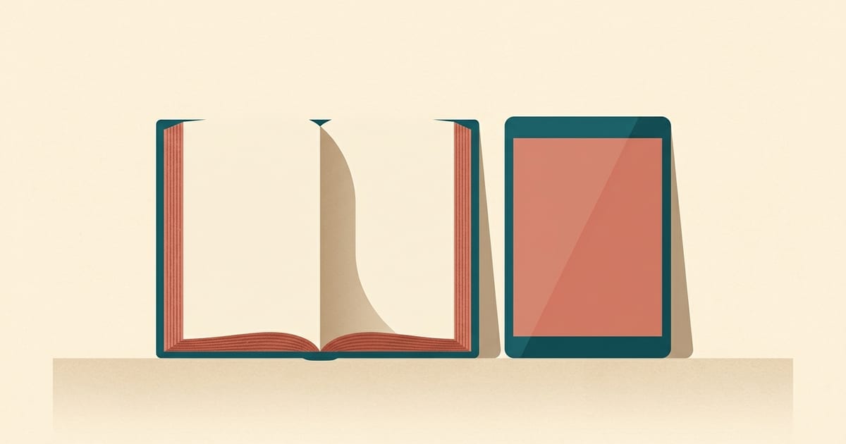 An open book beside a tablet propped upright on a table