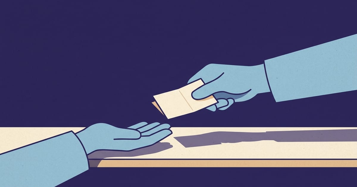 A folded note passed between two hands across a wooden counter